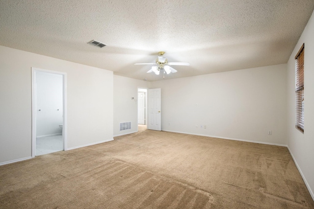 unfurnished bedroom with baseboards, visible vents, a textured ceiling, and carpet flooring