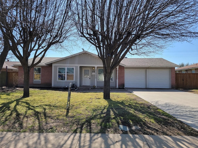 ranch-style home featuring brick siding, a front yard, and fence