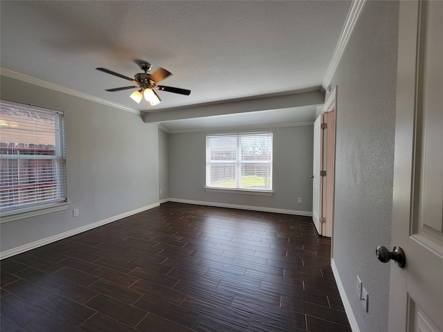 empty room with crown molding, dark wood finished floors, ceiling fan, a textured ceiling, and baseboards