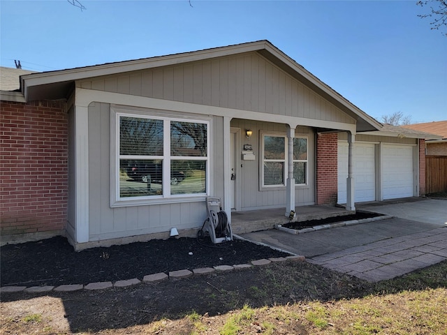 ranch-style home featuring a garage, driveway, a porch, and brick siding