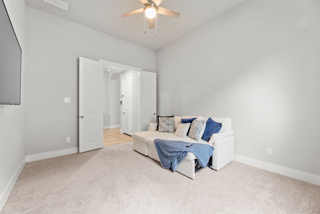 carpeted bedroom with ceiling fan, visible vents, and baseboards