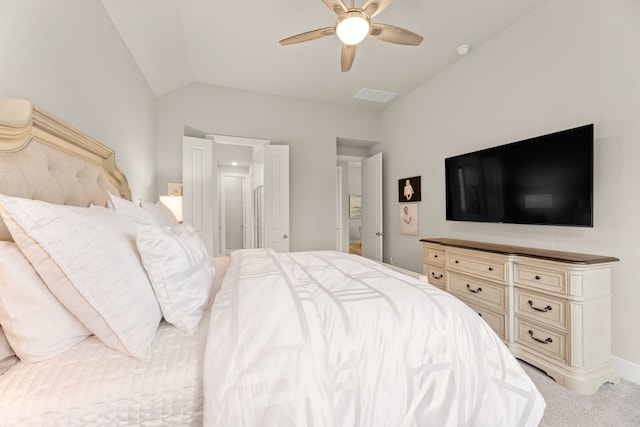 carpeted bedroom featuring visible vents, baseboards, vaulted ceiling, and a ceiling fan