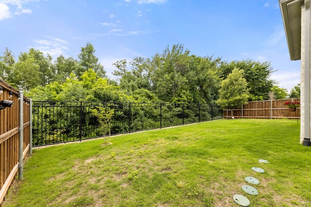 view of yard with a fenced backyard