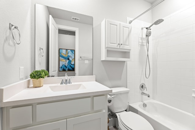 bathroom with visible vents, shower / tub combination, vanity, and toilet