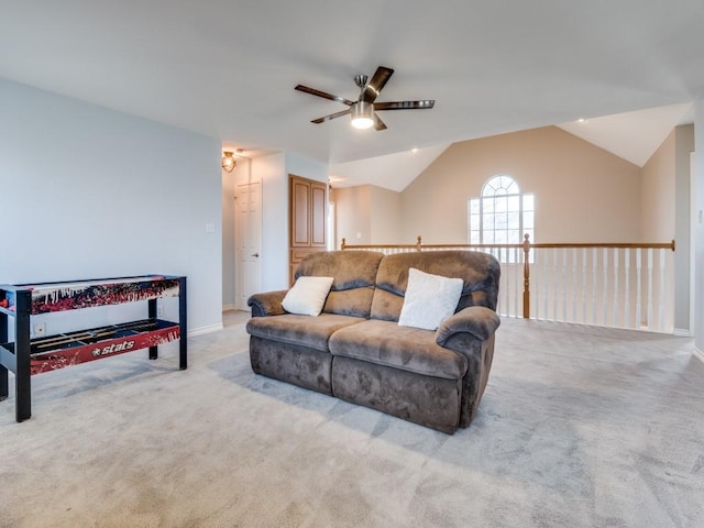 carpeted living room featuring lofted ceiling, ceiling fan, and baseboards