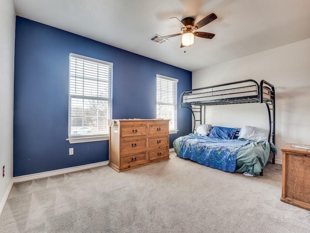 bedroom with a ceiling fan, carpet, visible vents, and baseboards