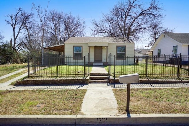 bungalow-style home with a fenced front yard and a front lawn