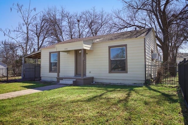 bungalow with a front yard and fence