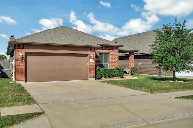 view of front of house featuring concrete driveway, an attached garage, a front lawn, central AC, and brick siding