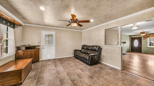 living area with visible vents, crown molding, baseboards, recessed lighting, and a ceiling fan