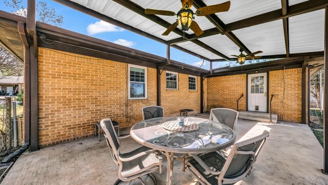 view of patio / terrace with outdoor dining space, entry steps, and a ceiling fan