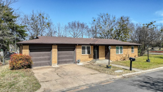 single story home featuring brick siding, driveway, a front yard, and a garage