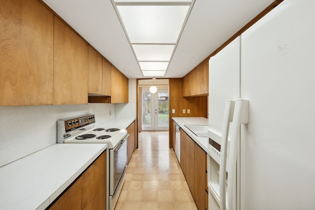 kitchen featuring brown cabinets, modern cabinets, a sink, white appliances, and light countertops