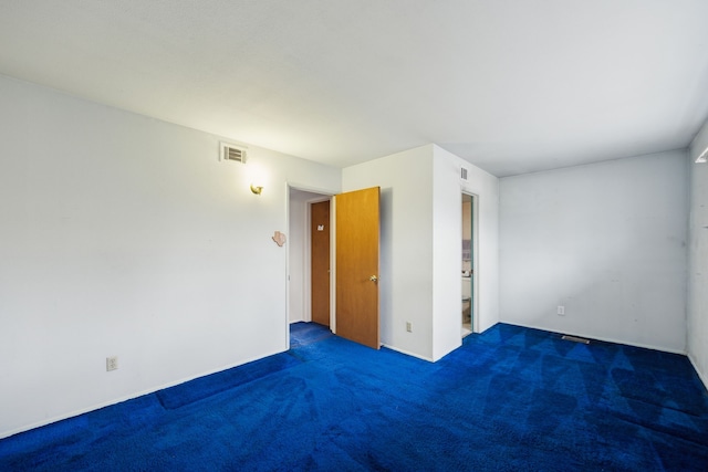 carpeted empty room with visible vents