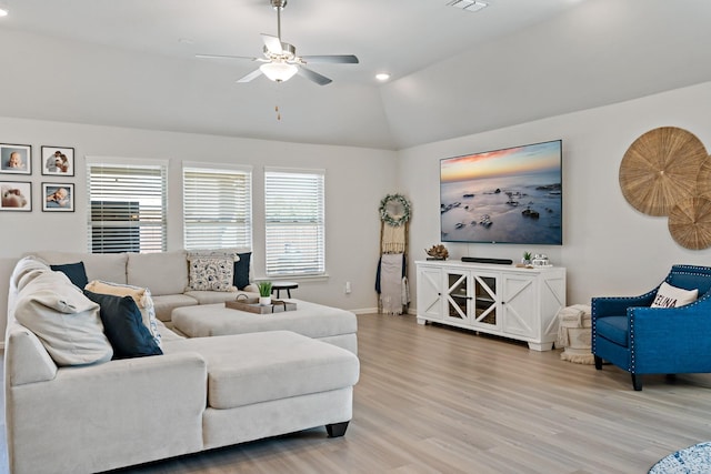 living area with recessed lighting, vaulted ceiling, ceiling fan, light wood-type flooring, and baseboards