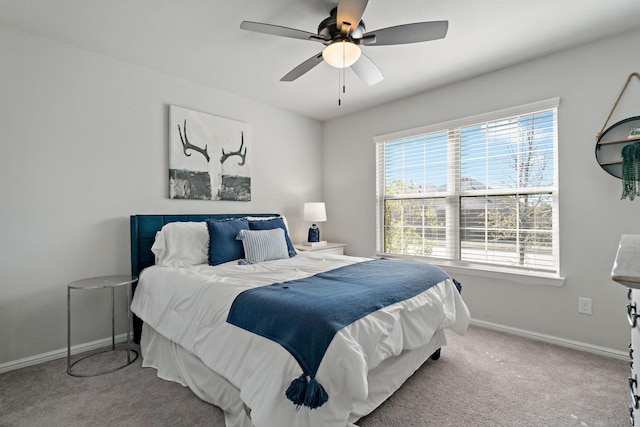 bedroom featuring carpet, baseboards, and a ceiling fan