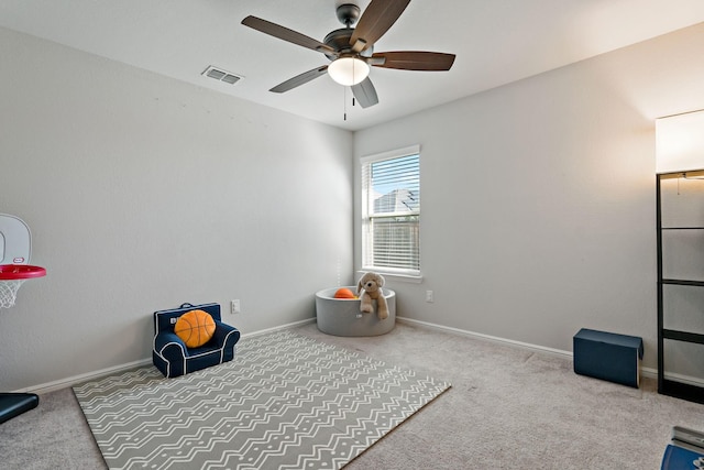 playroom with carpet flooring, a ceiling fan, and baseboards