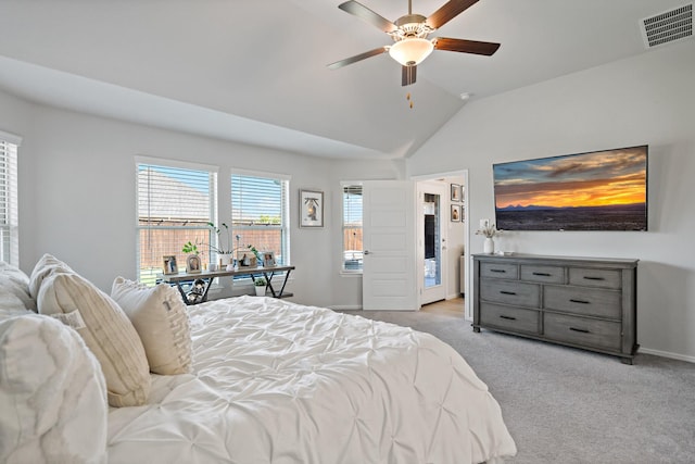 carpeted bedroom featuring a ceiling fan, visible vents, vaulted ceiling, and baseboards