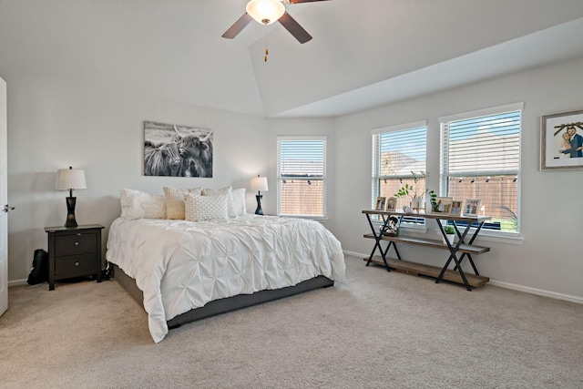 bedroom with lofted ceiling, ceiling fan, carpet flooring, and baseboards