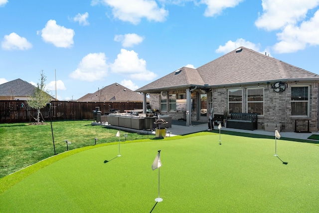 view of home's community featuring a yard, a patio area, and a fenced backyard