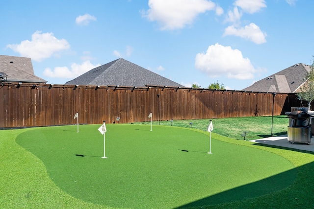 view of property's community with a fenced backyard