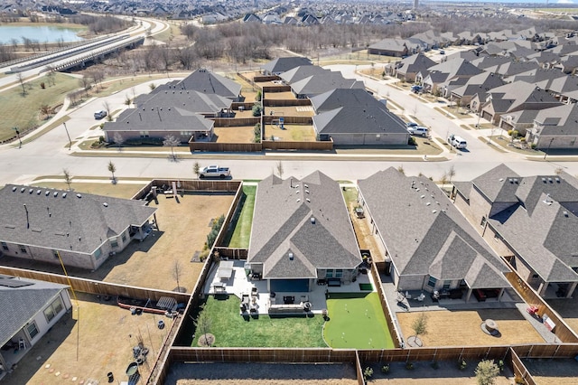 aerial view with a residential view and a water view