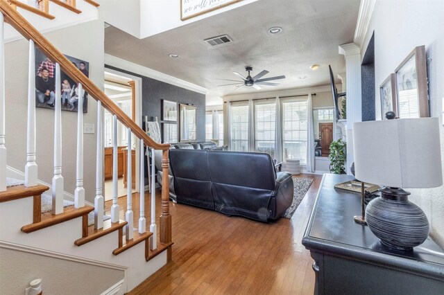 5033 Southpoint Dr, Arlington, TX 76017 - living area with ornamental molding, stairs, a ceiling fan, light wood finished floors, and recessed lighting