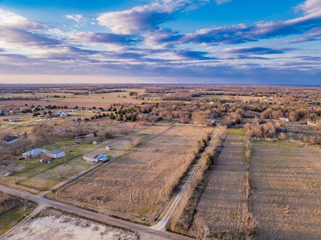 birds eye view of property featuring a rural view