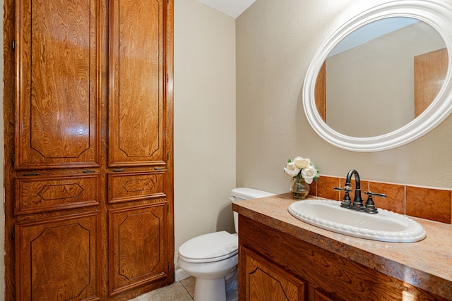 bathroom featuring vanity, toilet, and tile patterned floors