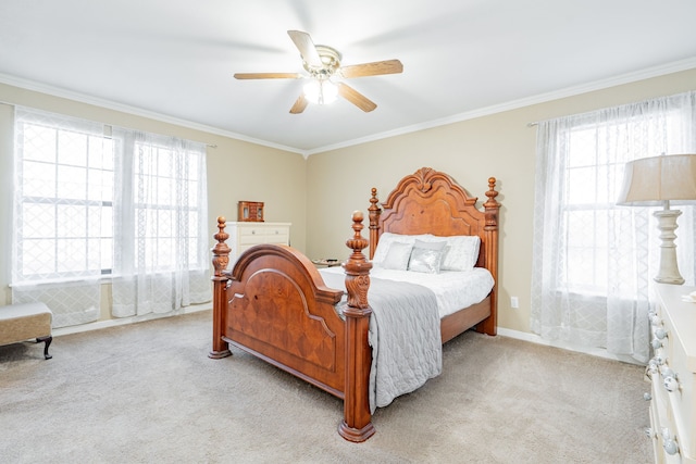 bedroom featuring light carpet, multiple windows, a ceiling fan, and crown molding