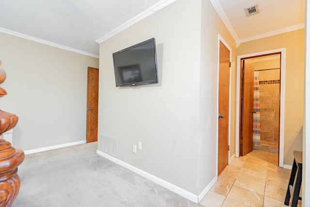 hallway with baseboards, visible vents, and crown molding