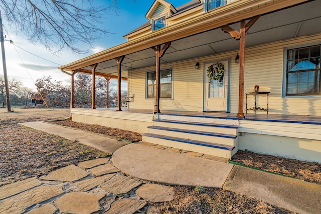 property entrance featuring covered porch