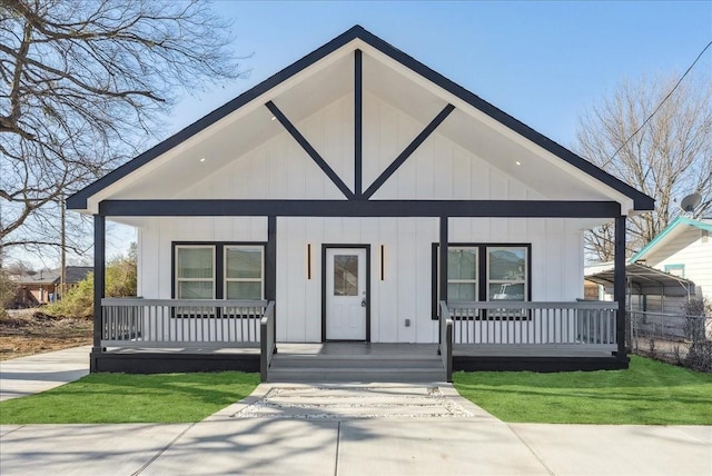 modern farmhouse style home with a porch and board and batten siding