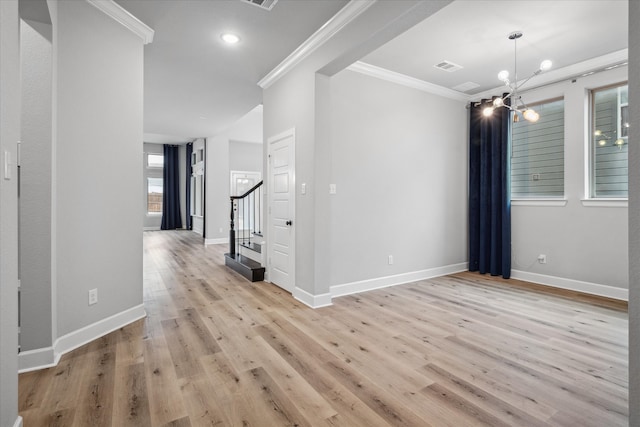 unfurnished room with baseboards, visible vents, stairs, crown molding, and light wood-style floors