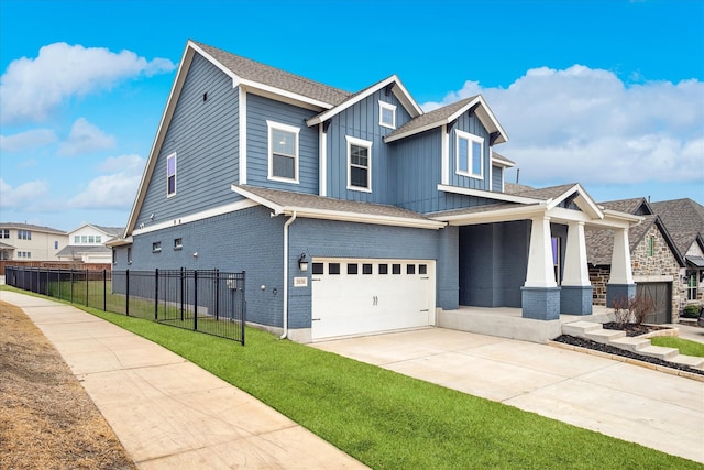 view of front of house featuring concrete driveway, fence, board and batten siding, and brick siding