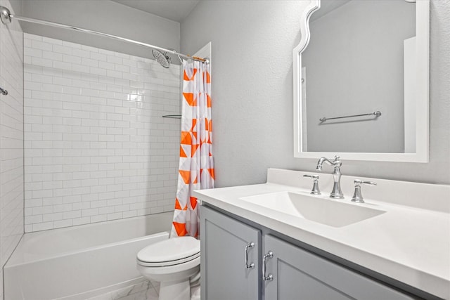 full bathroom with marble finish floor, shower / bath combination with curtain, a textured wall, toilet, and vanity