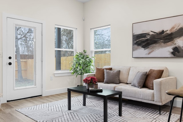 interior space with light wood finished floors and baseboards