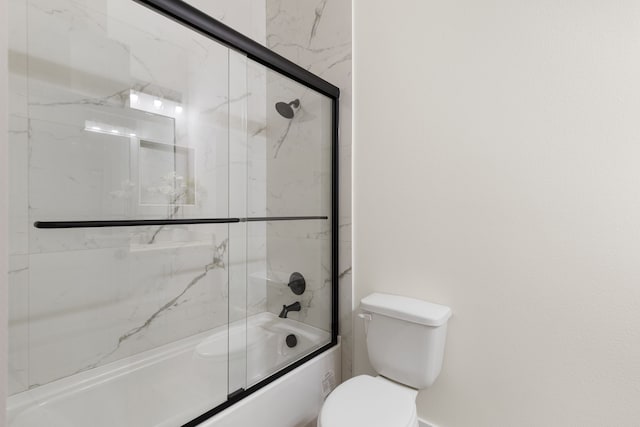 full bath with shower / bath combination with glass door and toilet