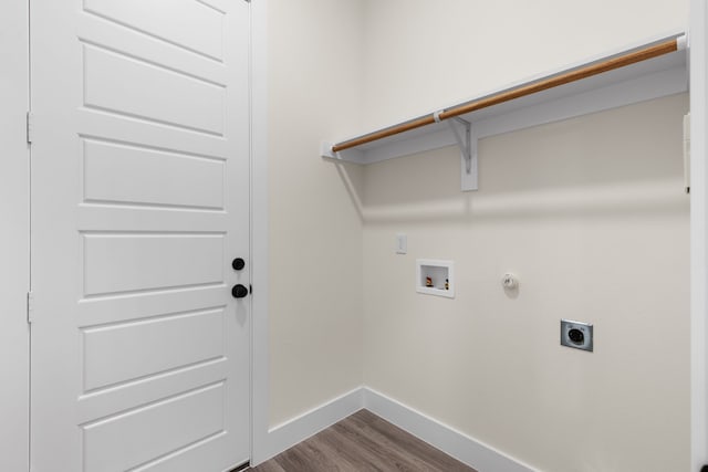 clothes washing area with laundry area, dark wood-type flooring, washer hookup, baseboards, and electric dryer hookup