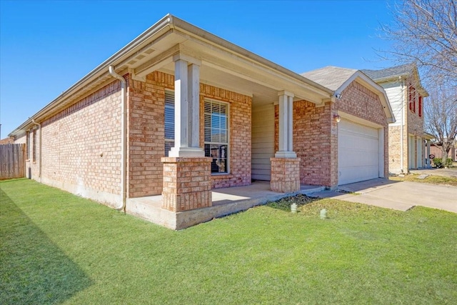 view of front facade featuring a garage, a front lawn, concrete driveway, and brick siding