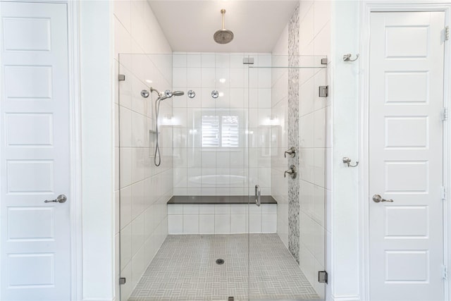 bathroom with a shower stall