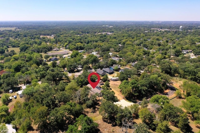 drone / aerial view featuring a forest view