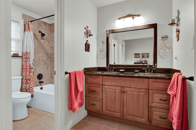 bathroom featuring toilet, shower / tub combo, a sink, tile patterned floors, and double vanity