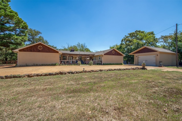 ranch-style house featuring a front yard and an outdoor structure