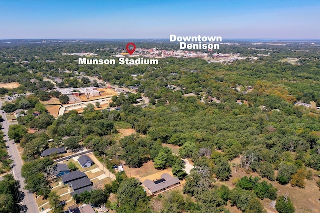 bird's eye view featuring a wooded view