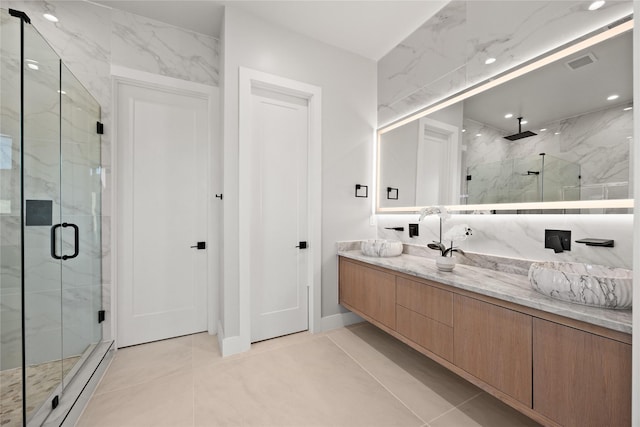 bathroom with a marble finish shower, recessed lighting, visible vents, vanity, and tile patterned floors