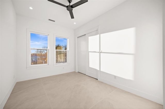 unfurnished room featuring a ceiling fan, recessed lighting, visible vents, and baseboards