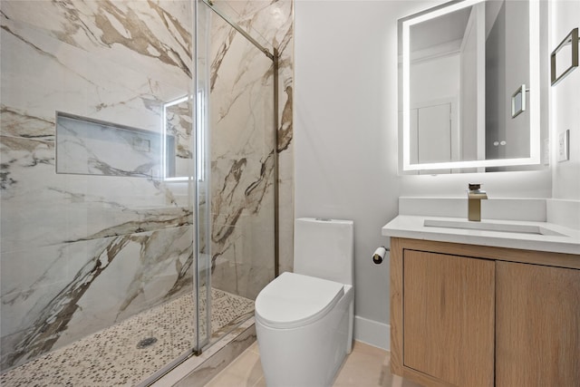 full bathroom featuring toilet, a marble finish shower, and vanity