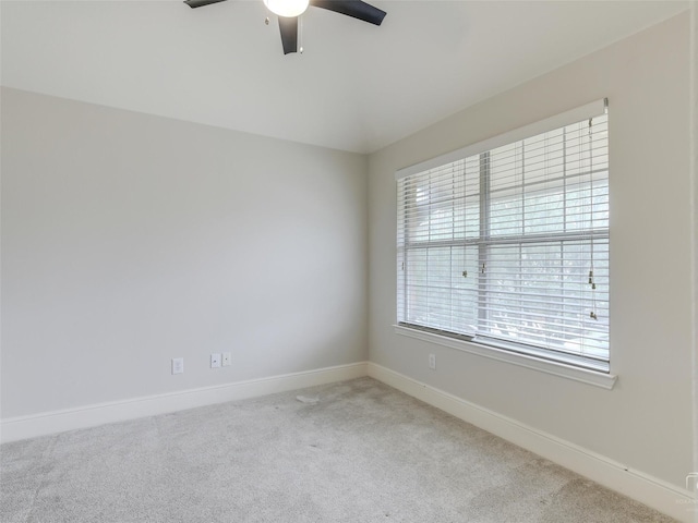 unfurnished room with ceiling fan, carpet, and baseboards