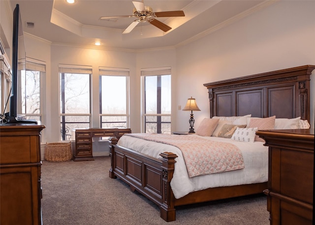 carpeted bedroom with ceiling fan, visible vents, crown molding, a tray ceiling, and recessed lighting